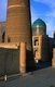 Uzbekistan: The Kalyan or Kalon minaret with the dome of the Mir-i-Arab Madrasah in the background, part of the Po-i-Kalyan complex, Bukhara